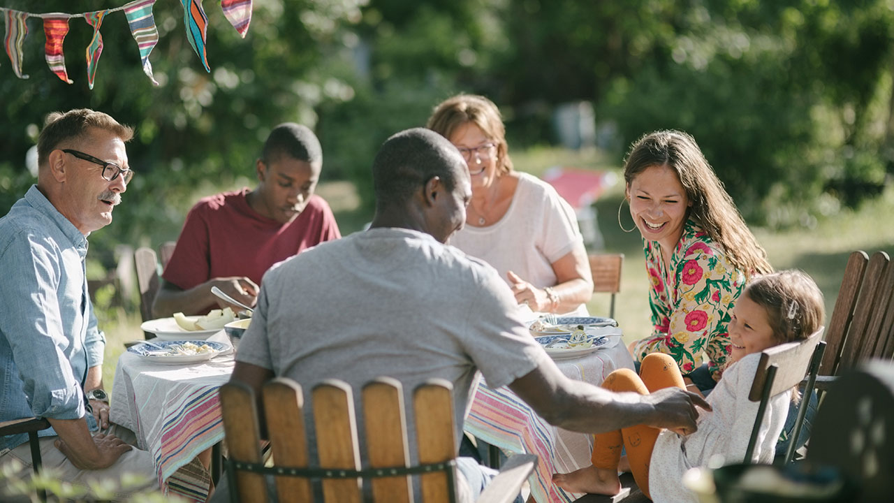 Family having dinner at their backyard